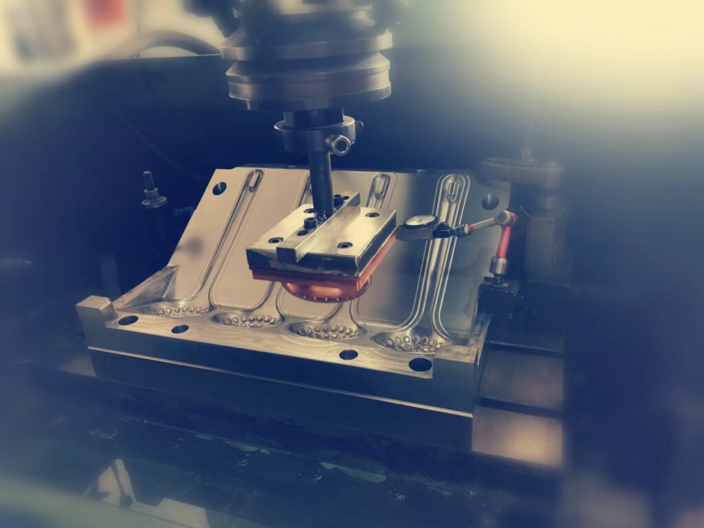 CNC machinery engraving the mold details
