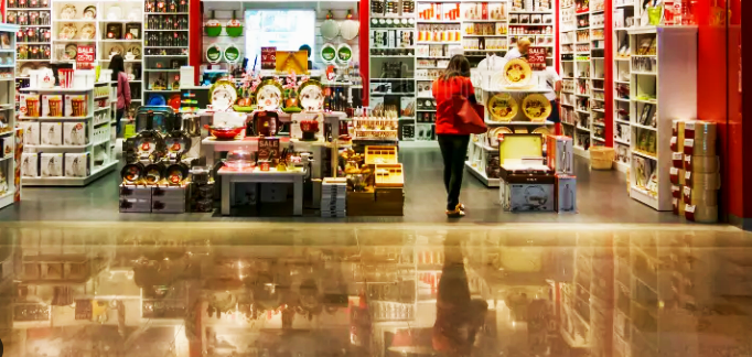 a women shopping by a kitchenware shop